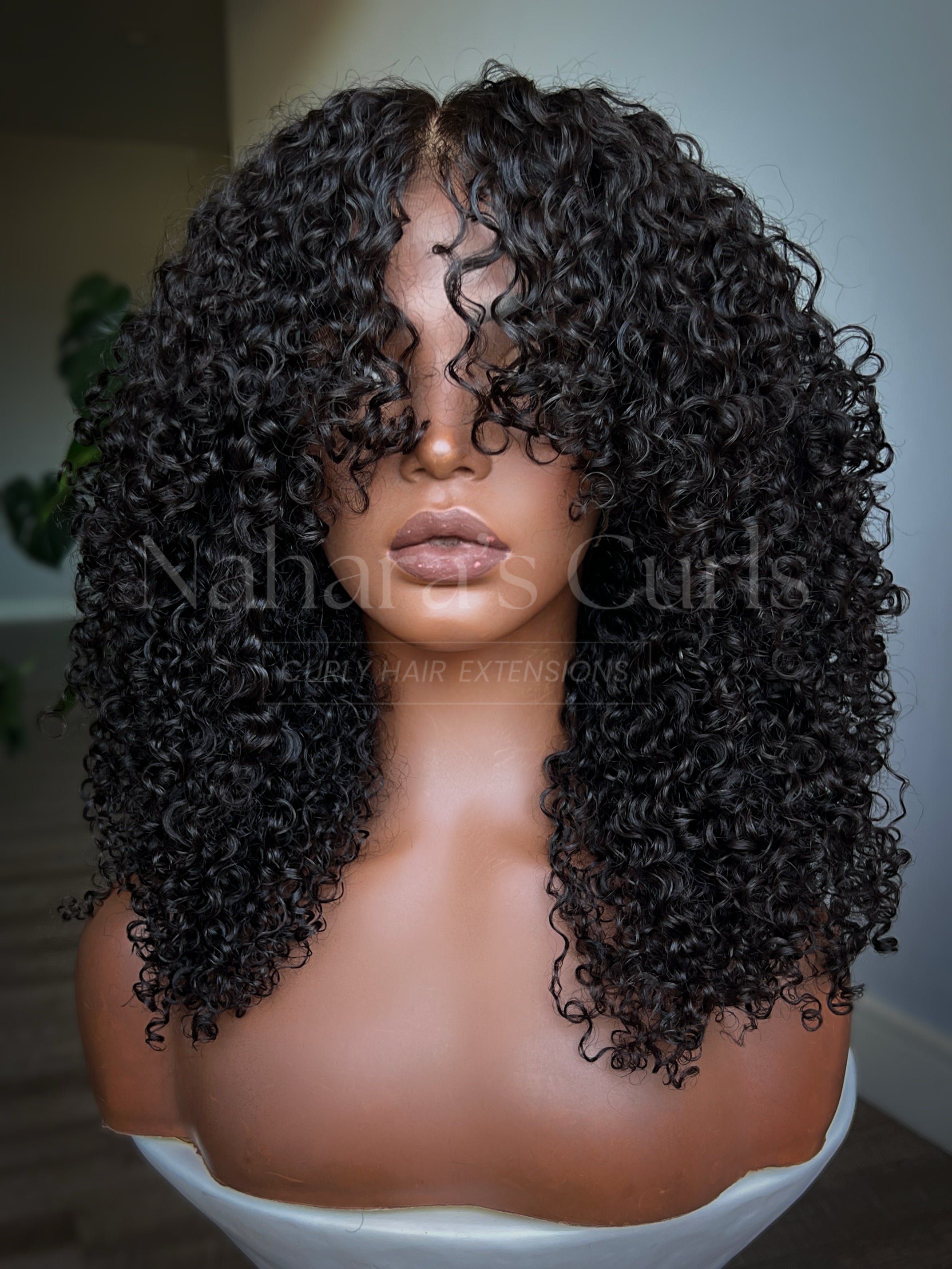 Medium-length Burmese curly wig with layered shag cut and realistic HD lace hairline