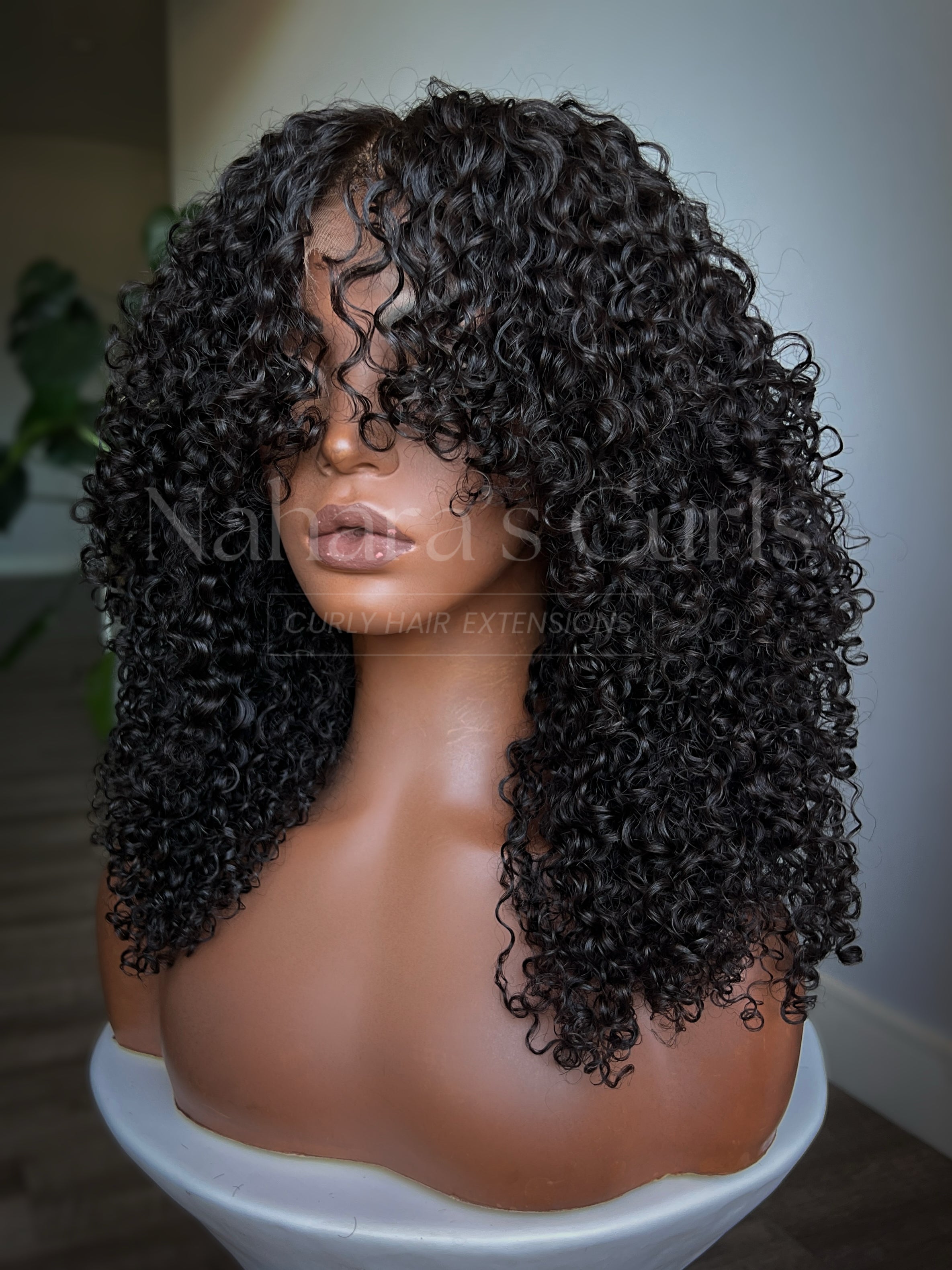 Curly shag wig made with human hair featuring soft Burmese curls, 13x6 HD lace front, and natural face-framing layers