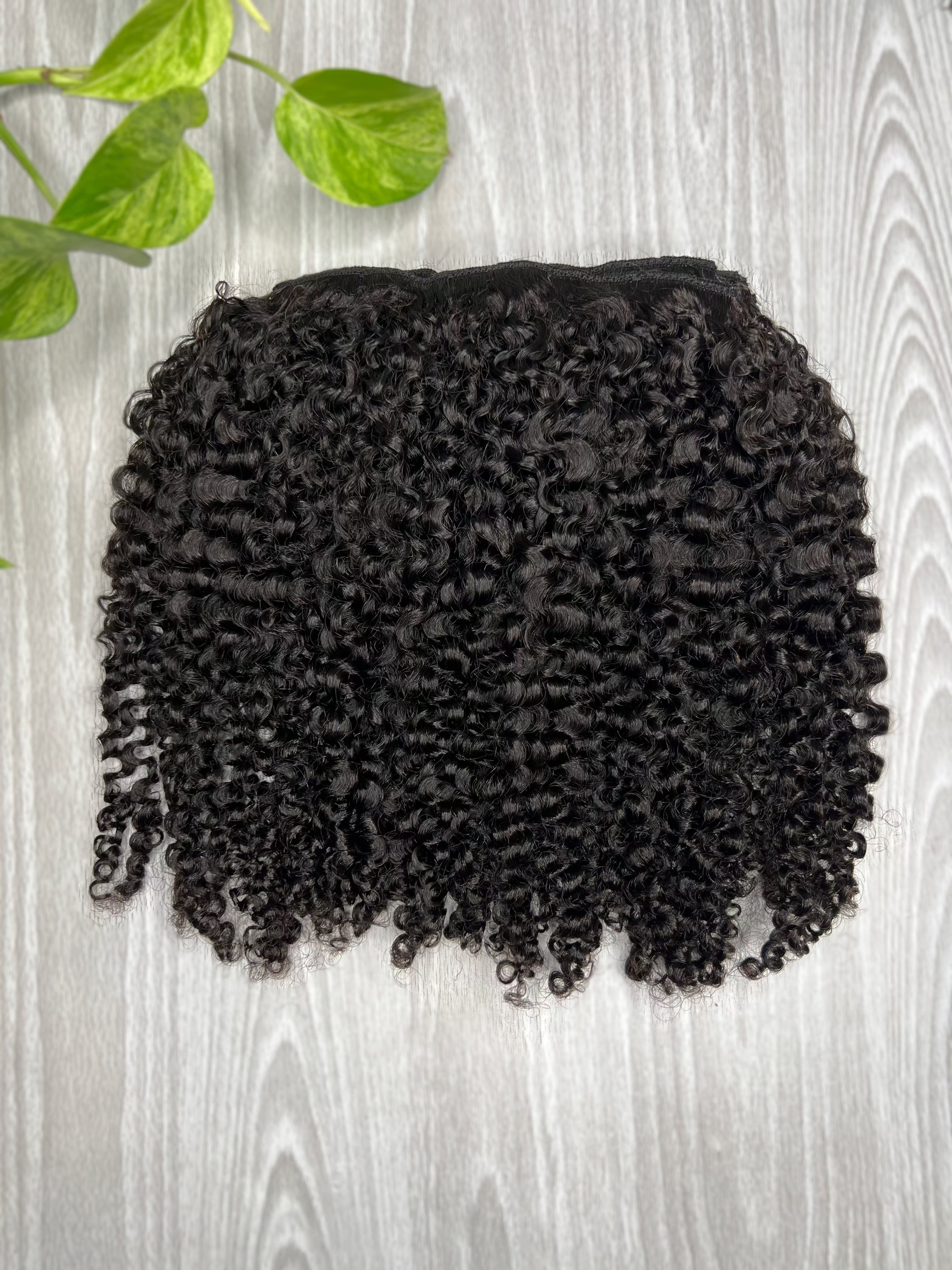 Coily Aura Clip-Ins for natural hair, full and voluminous kinky curls from root to tip.