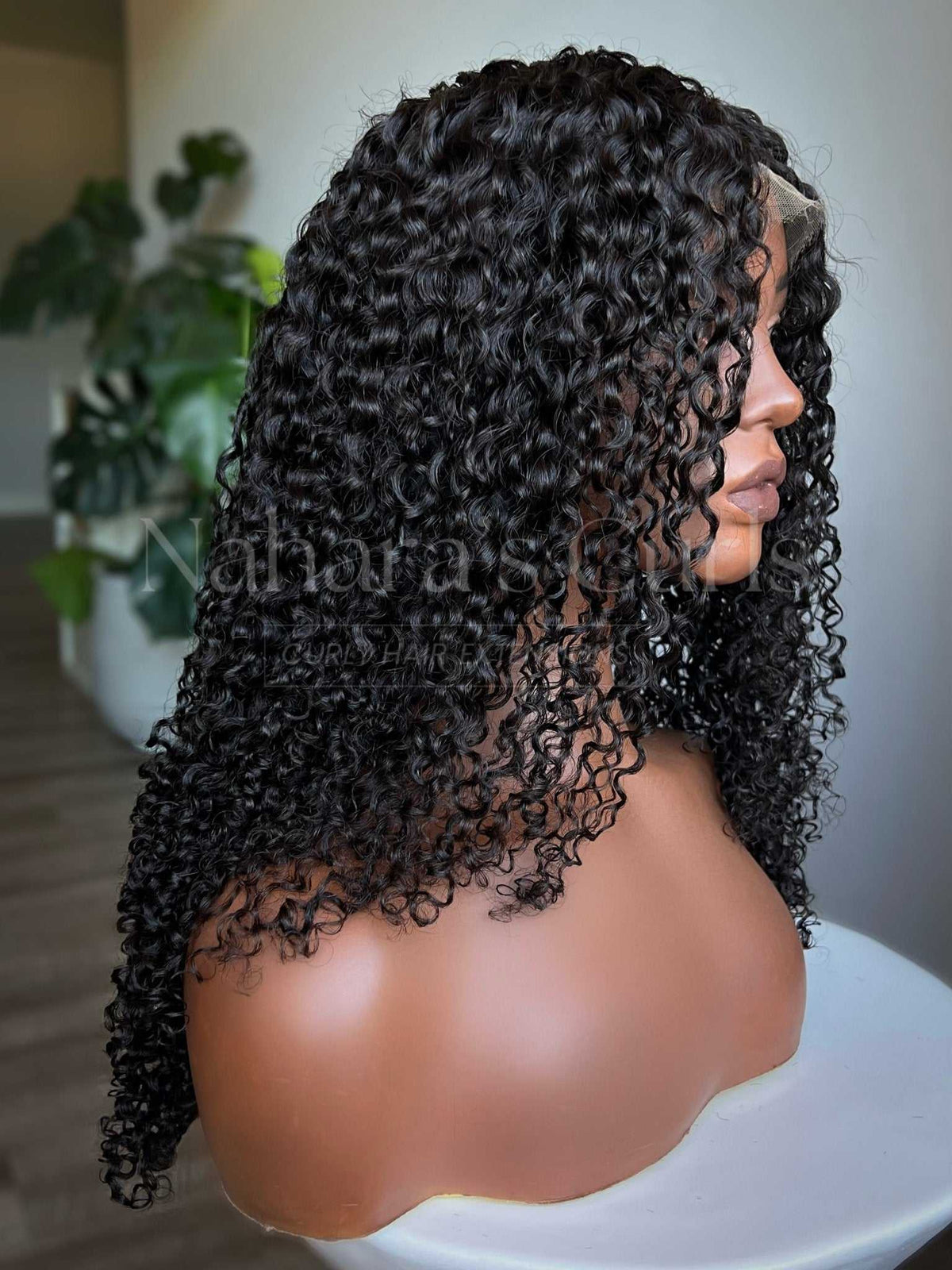 Side profile of the Amala wig showing curl shape and 16 inch length