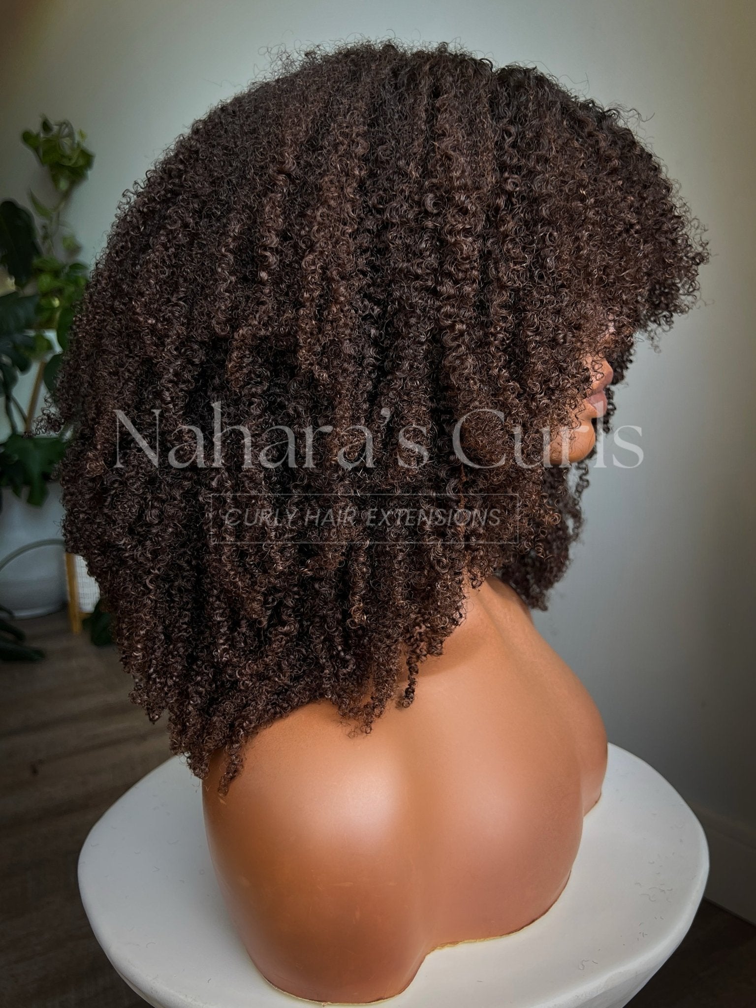 Side view of the Amara 13 by 6 HD Lace Front Wig displaying volume and curl shape