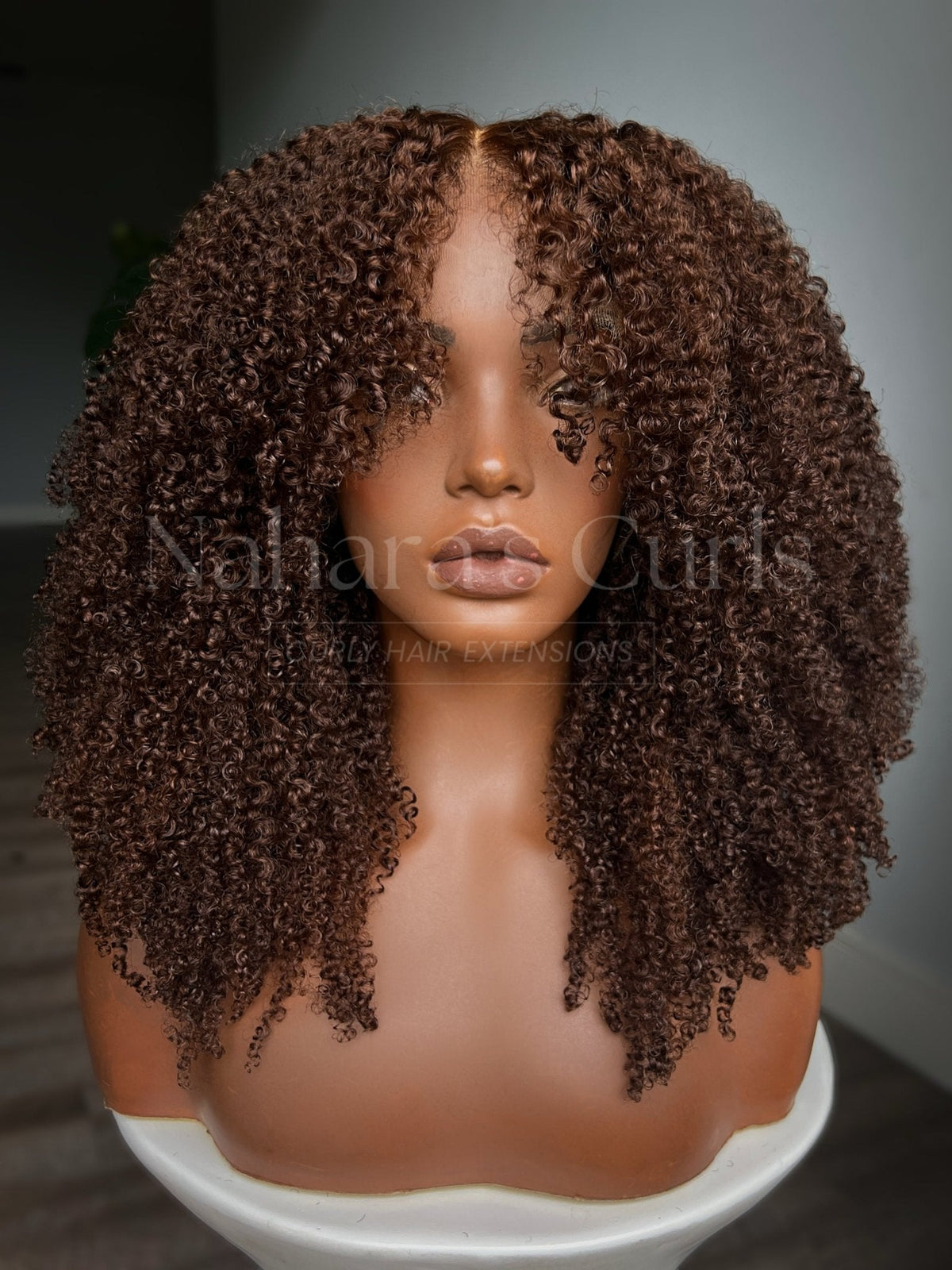 Aruna custom ginger kinky curly lace front wig with layered curls framing the face