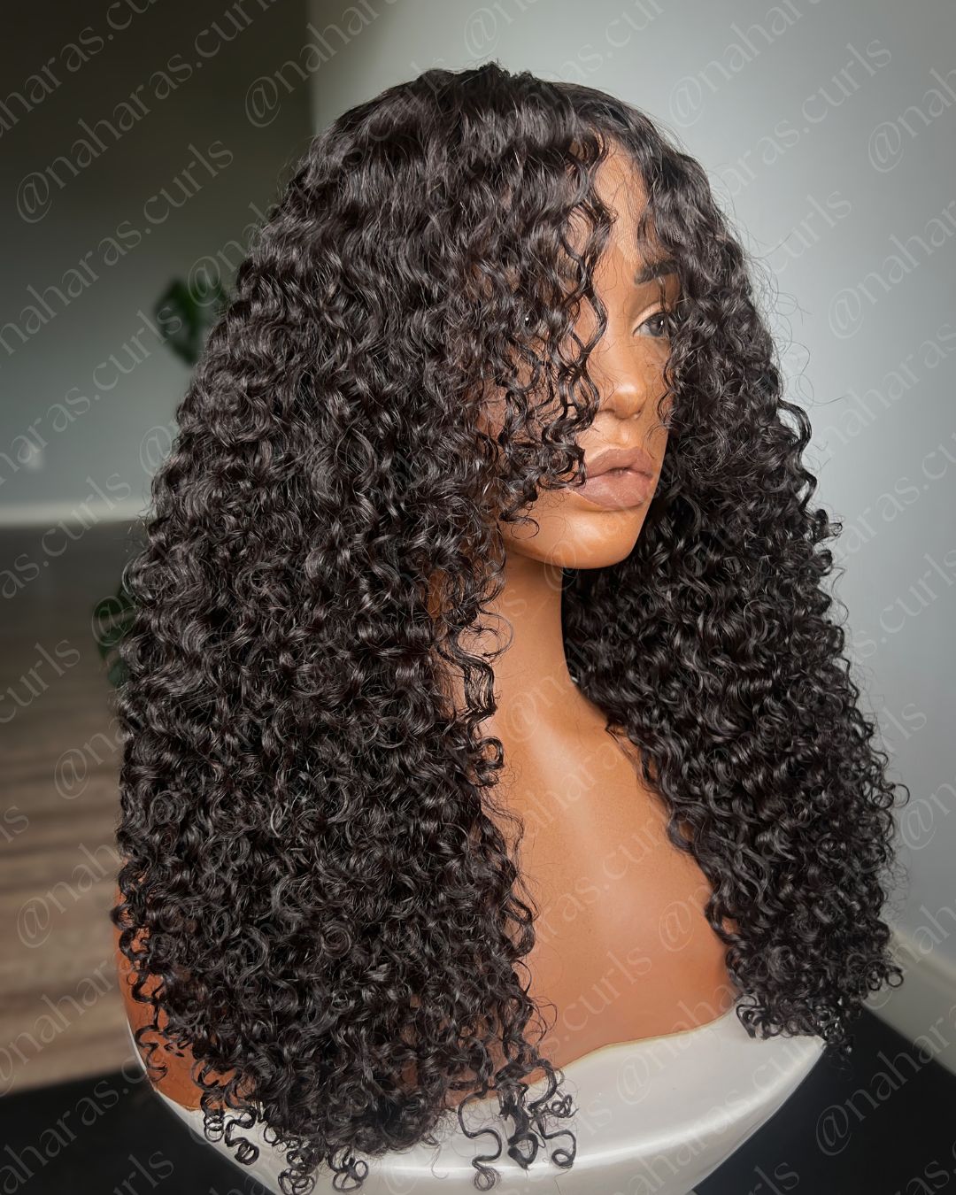 Side view of Lila 13x6 HD Lace Front Wig highlighting full curl volume and layered shape