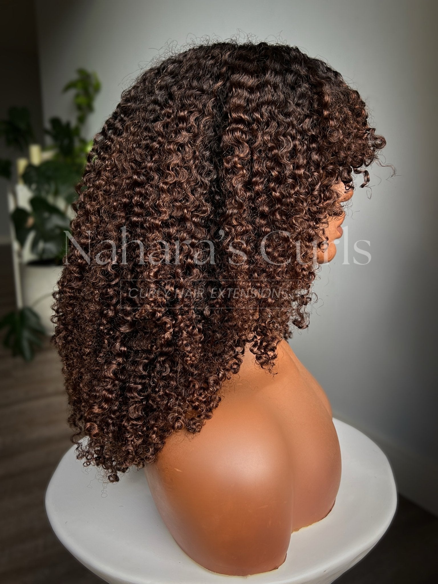 Angled view of Nila 13 by 6 HD Lace Front Wig with soft kinky curls and natural texture