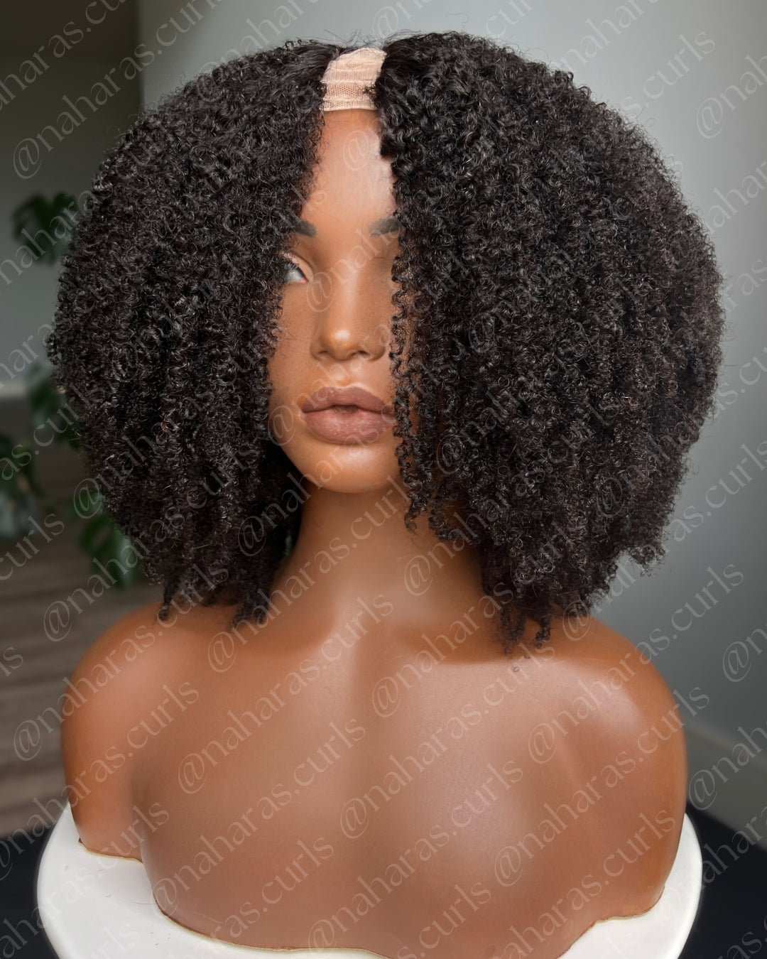 Curly Taj U-Part Wig showing middle part and defined coils