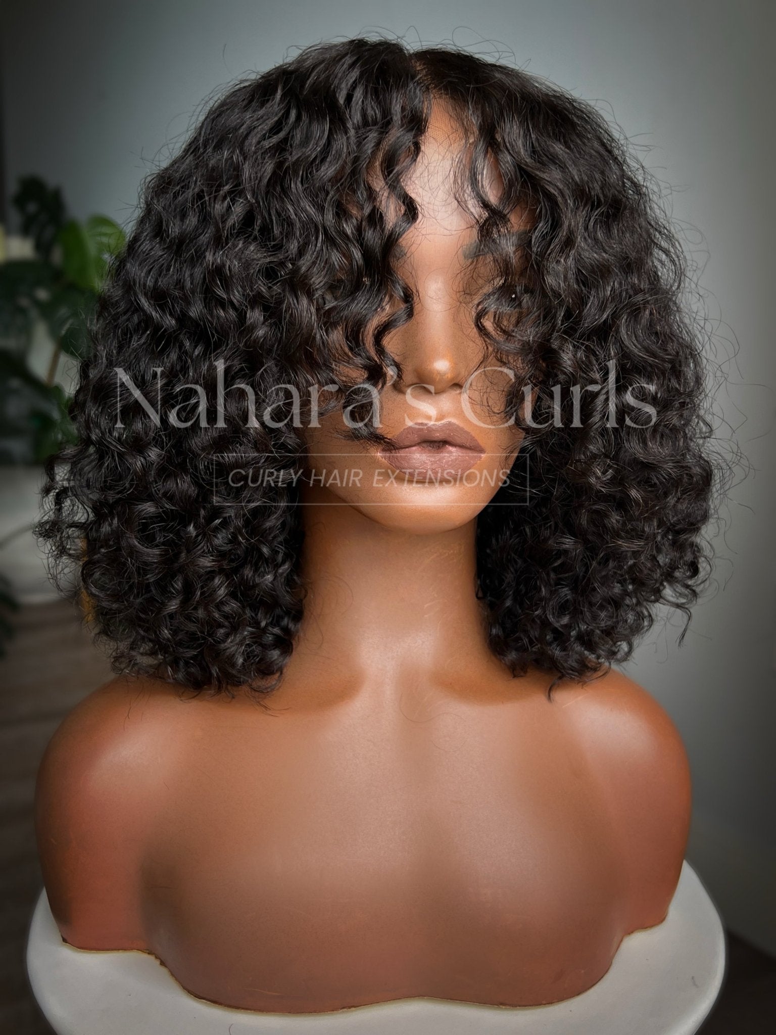 Front view of Umika 13 by 6 HD Lace Front Wig showing Tula Soft Wave (3A/3B) curls