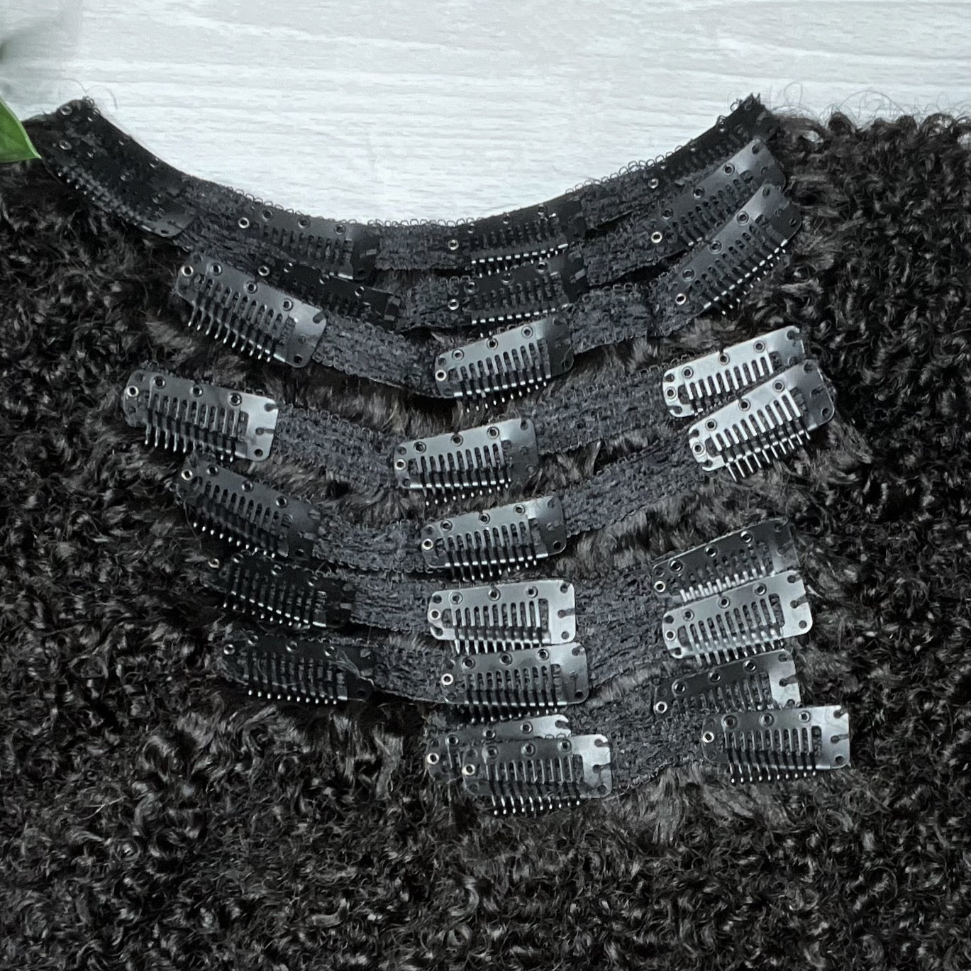 Taj Clip-In Extensions showing secure clips and coily hair texture by Nahara’s Curls.