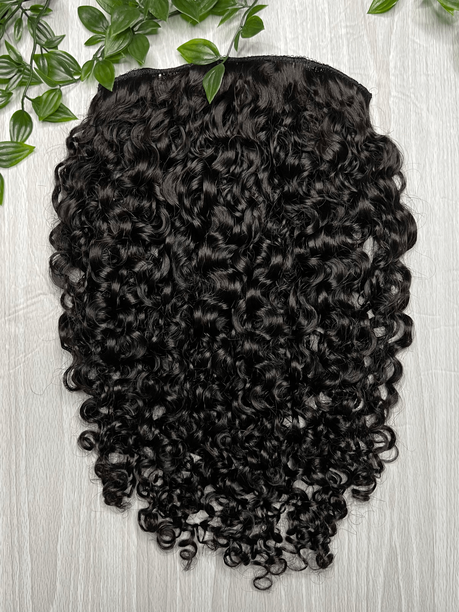 Tula clip-in hair extensions made from 100% virgin Indian hair with natural loose curls