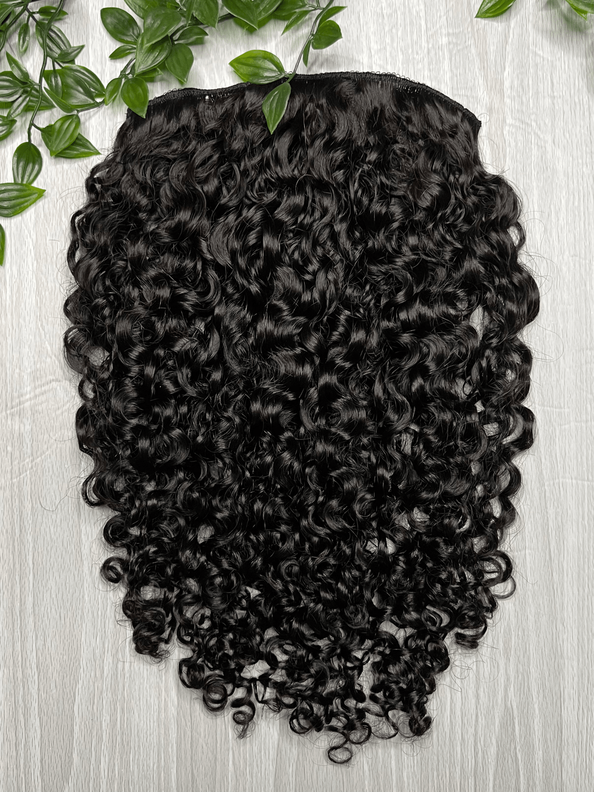 Tula clip-in hair extensions made from 100% virgin Indian hair with natural loose curls