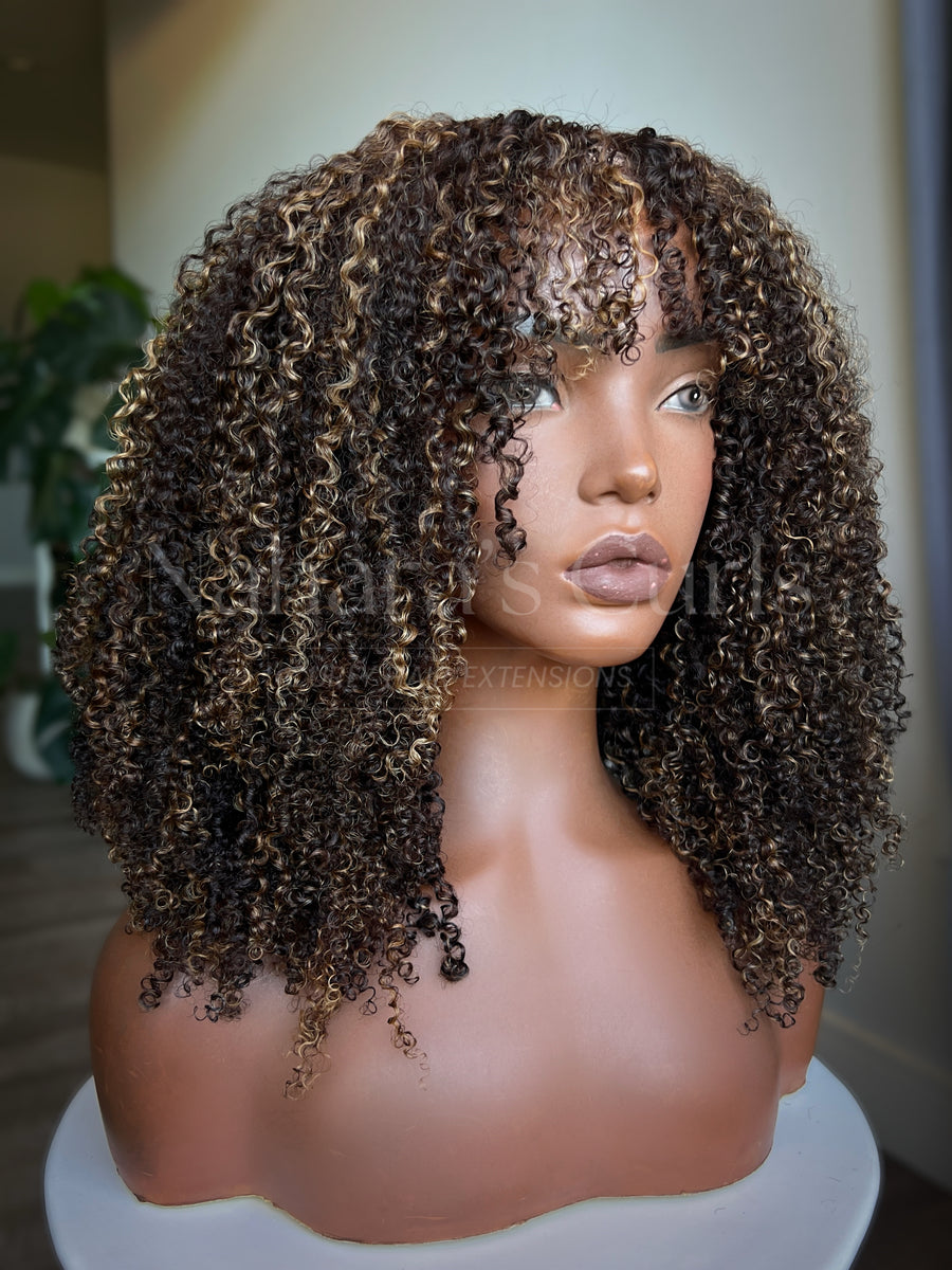 Kinky curly human hair U-part wig with caramel highlights and full layered curls on mannequin