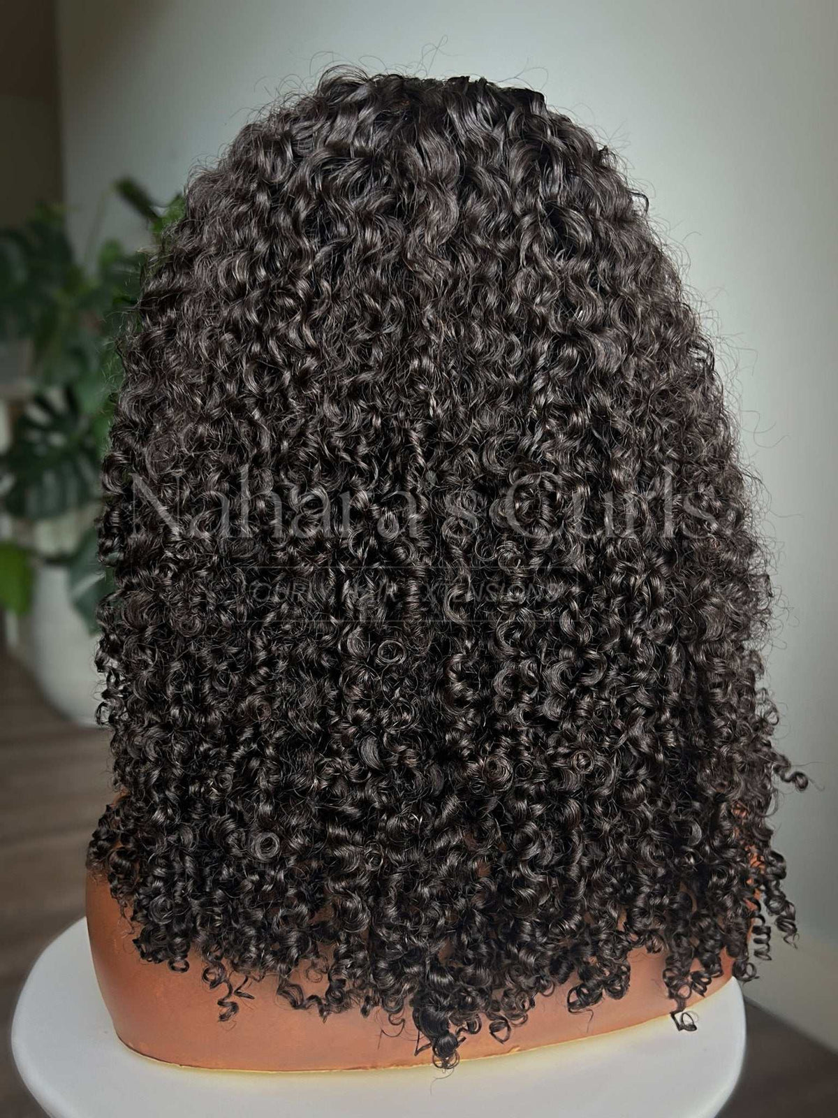 Back view of the Amala wig showing full 150% density from root to ends