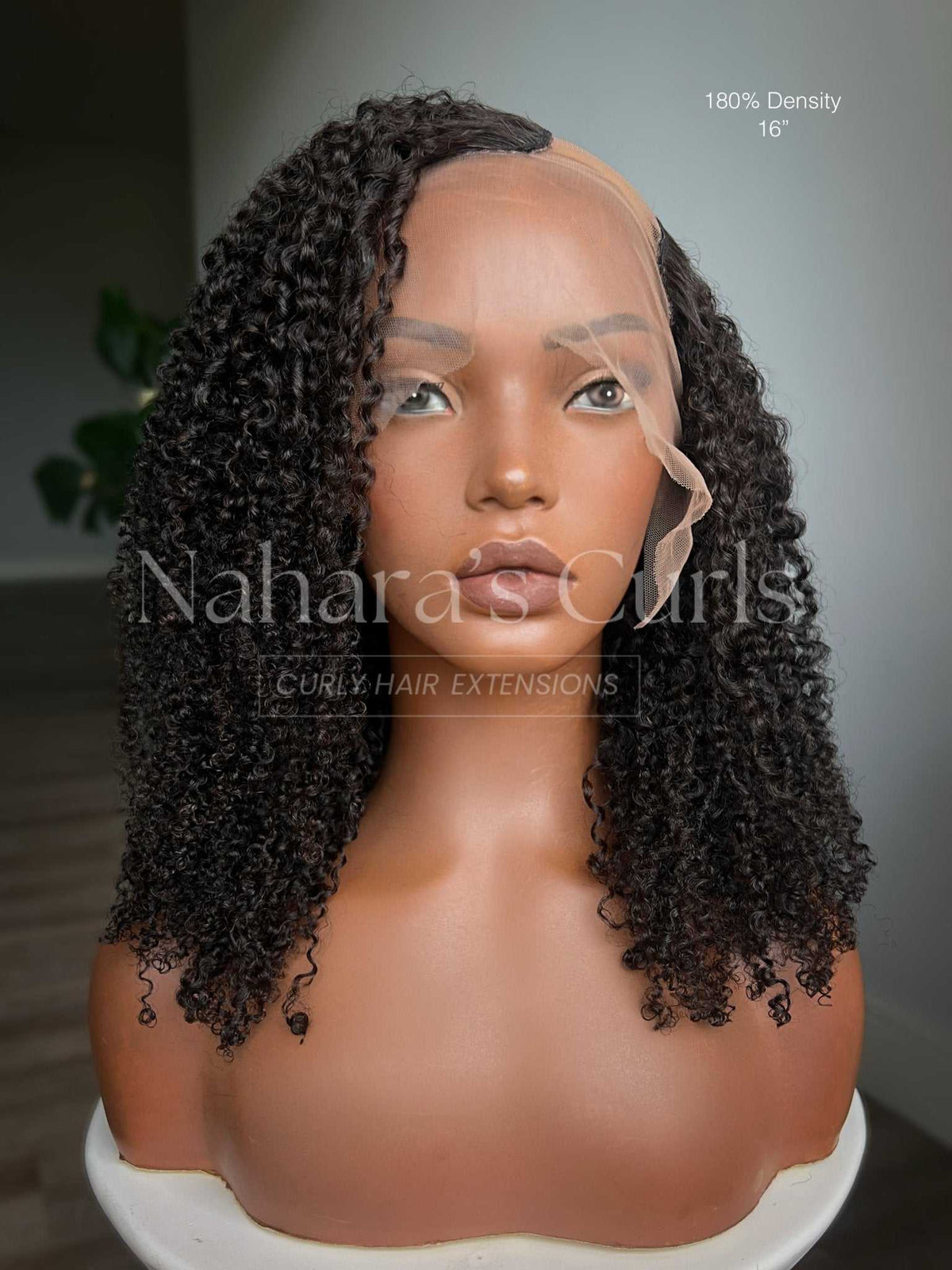 Front view of the Aura kinky curly U-part wig with a soft side part