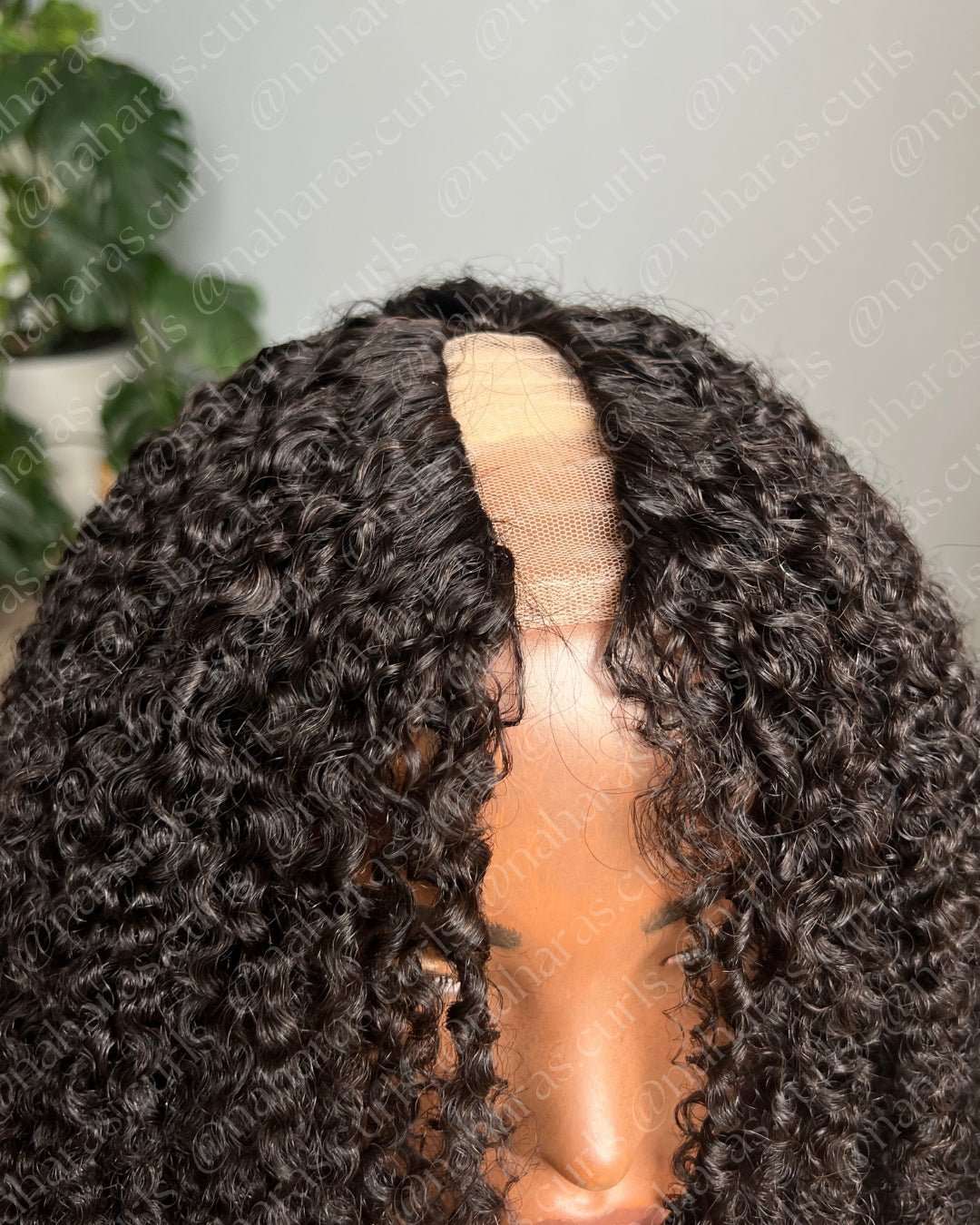 Curly Aura U-Part Wig showing natural part and seamless blend