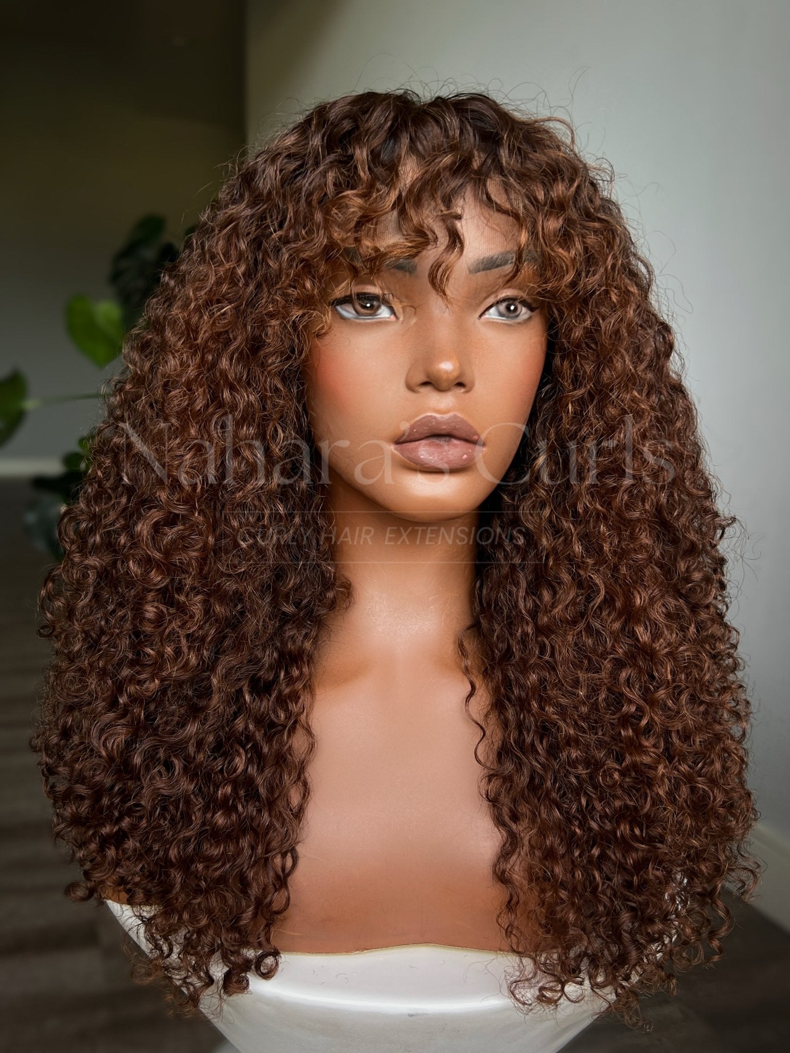 Long beach wave human hair wig with flowing bohemian curls, dimensional copper brown balayage, and natural-looking HD lace front

