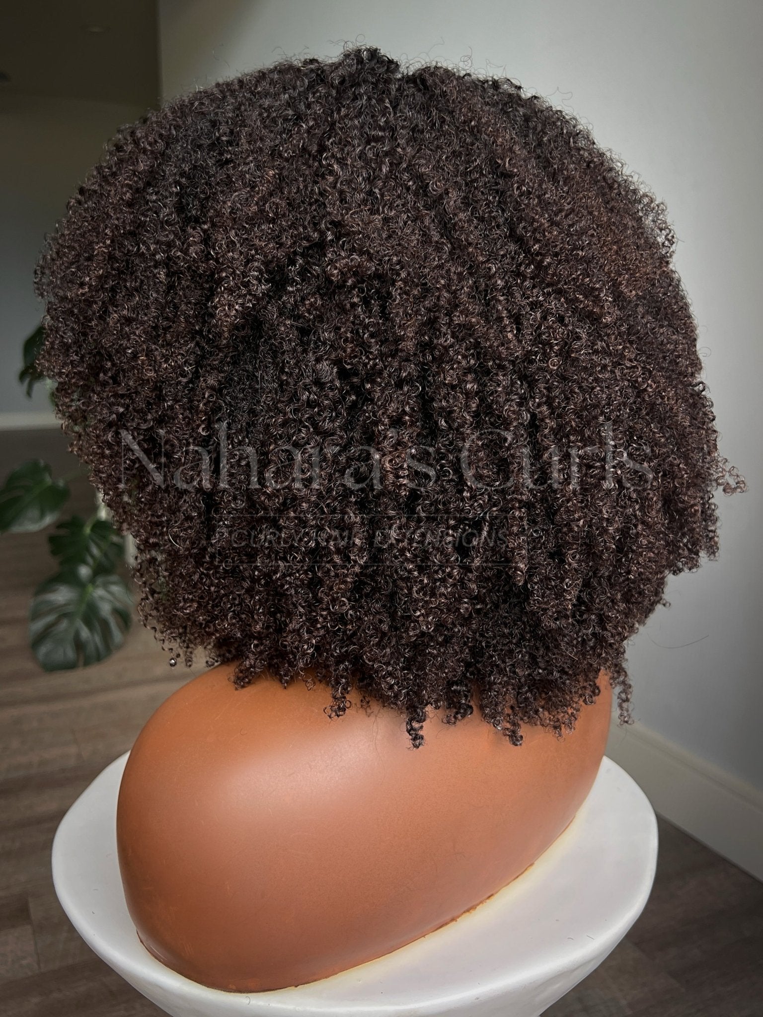 Kinky coily custom wig showing back volume and natural dark brown textured curls — Nahara's Curls