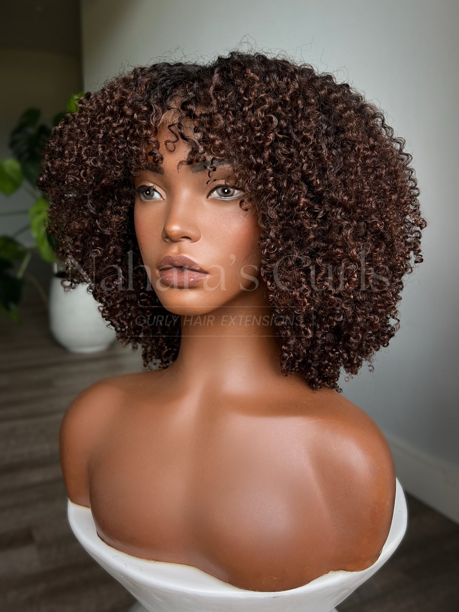 Human hair kinky curly wig featuring soft defined curls, natural roots, and brown balayage
