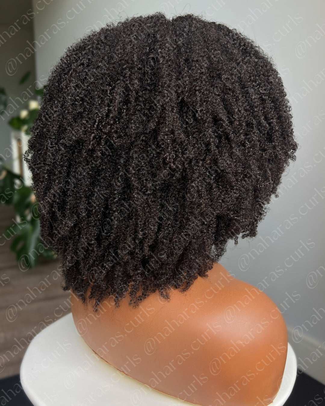Close-up of Taj U-Part Wig – natural coils and seamless blend