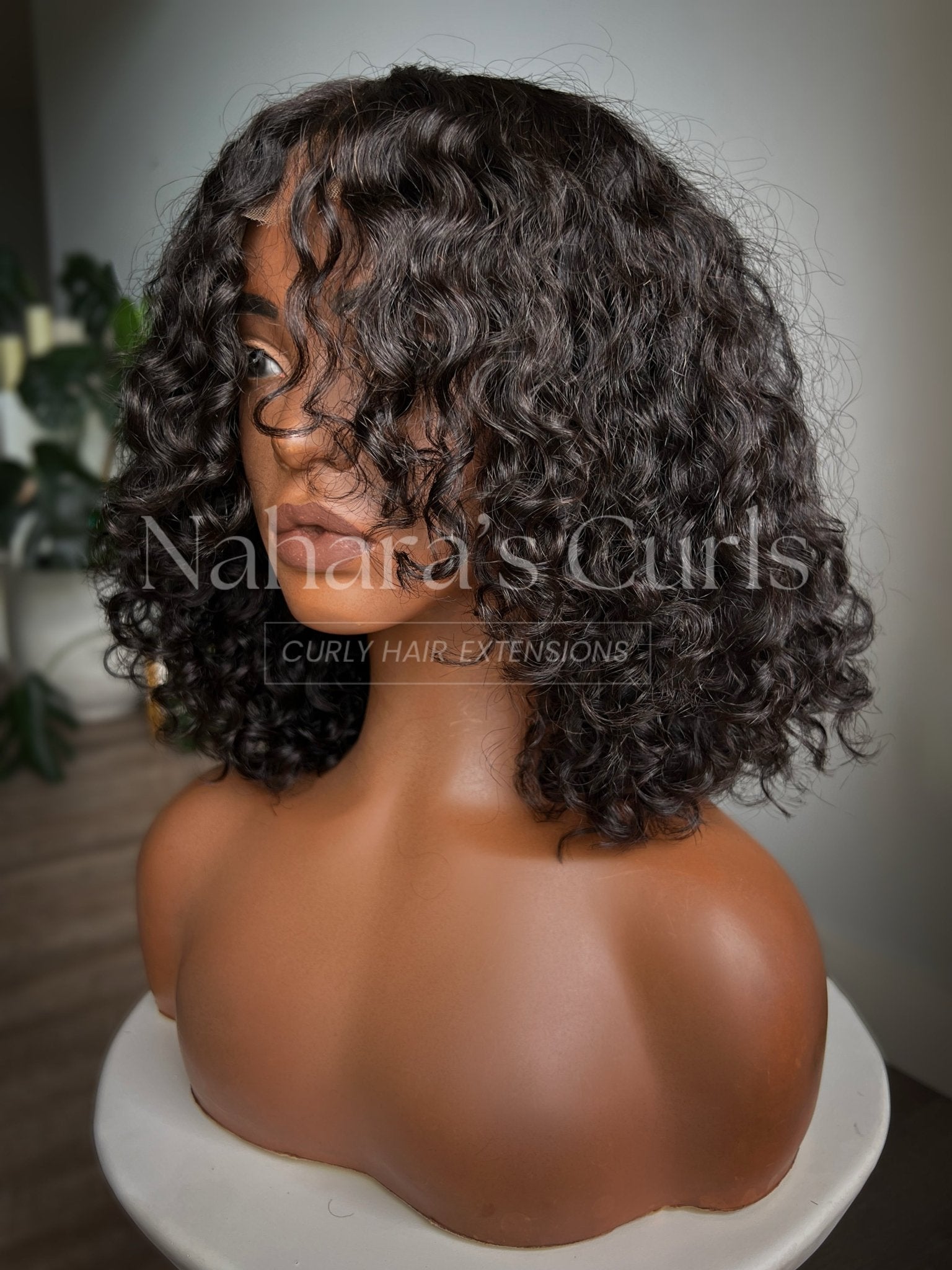 Front view of Umika 13 by 6 HD Lace Front Wig showing Tula Soft Wave (3A/3B) curls