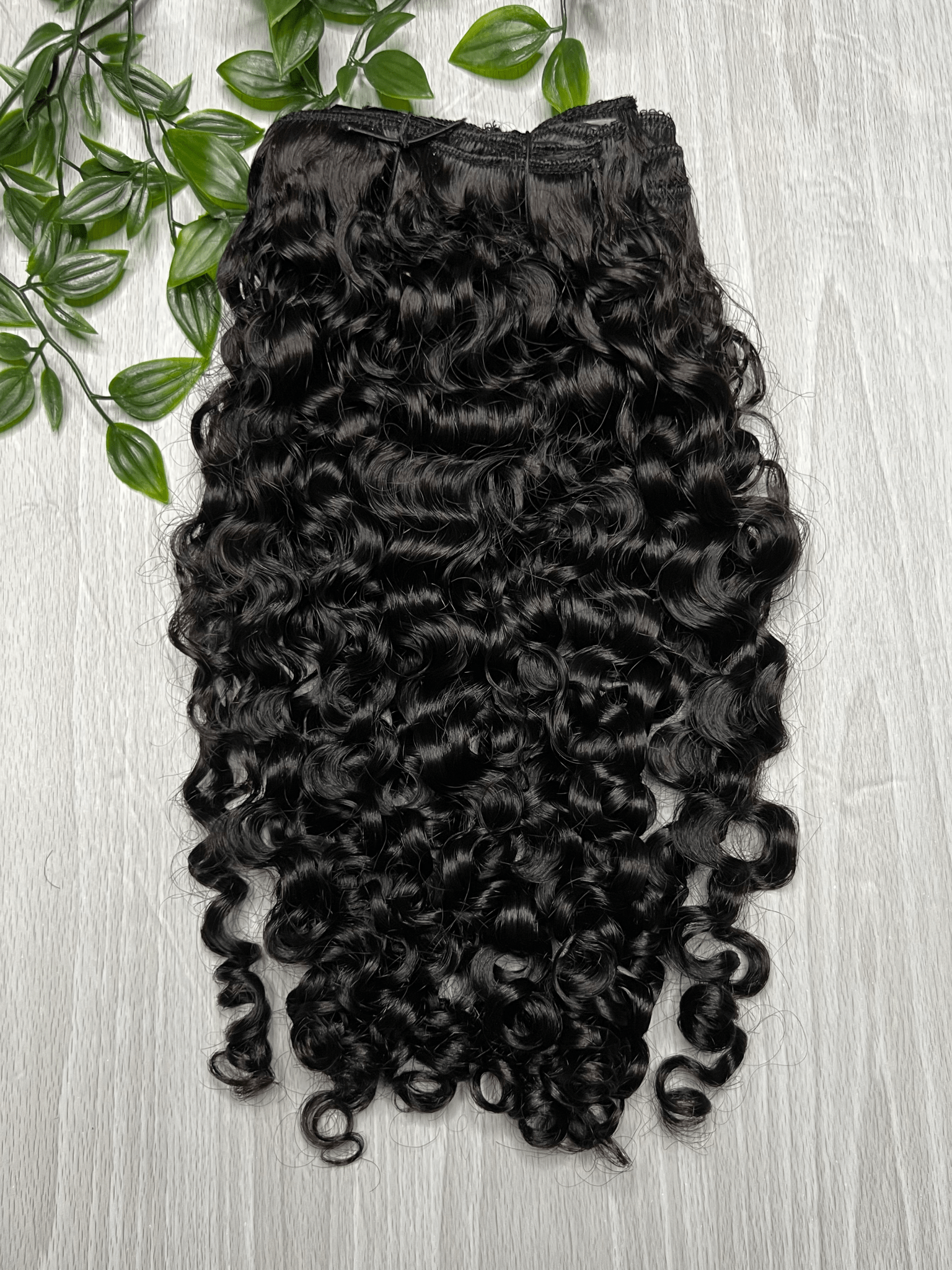 Tula Clip-Ins Extensions made of 100% virgin Indian hair with flowing loose waves and natural volume